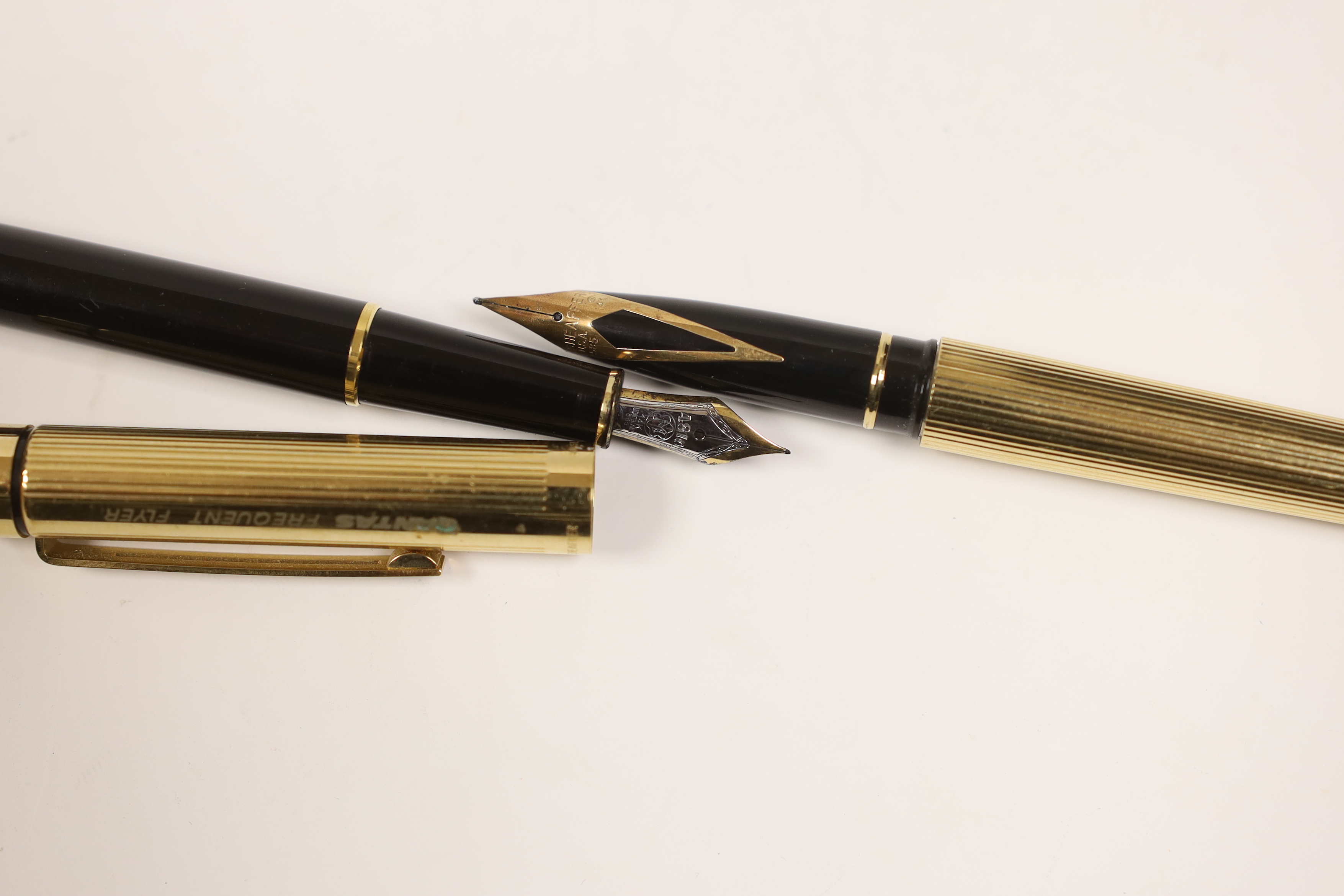 A Montblanc fountain pen and a promotional Qantas ‘Frequent Flyer’ pen